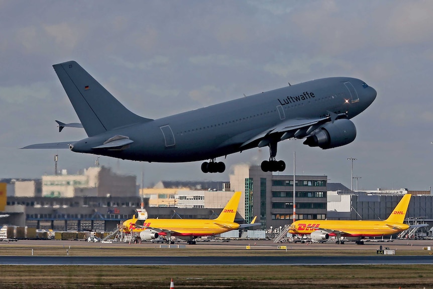 An airplane of the German air force lifts off towards China at the Cologne Bonn Airport in Cologne.