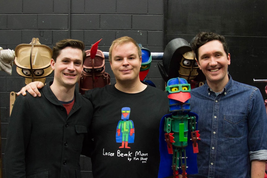 Creative producer Nicholas Paine, artist Tim Sharp and director David Morton with Laser Beak Man.
