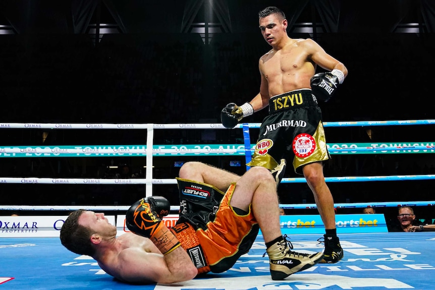 Tim Tszyu (right) looks on as Jeff Horn goes to the ground.