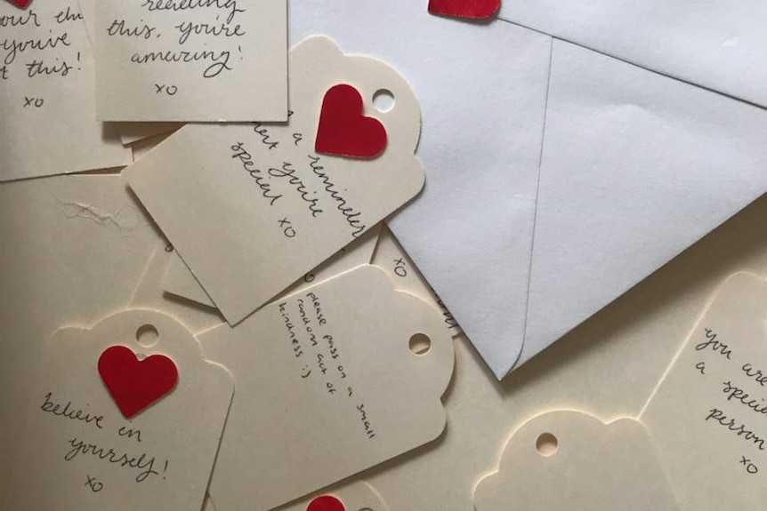 Tags with handwritten compliments on them 