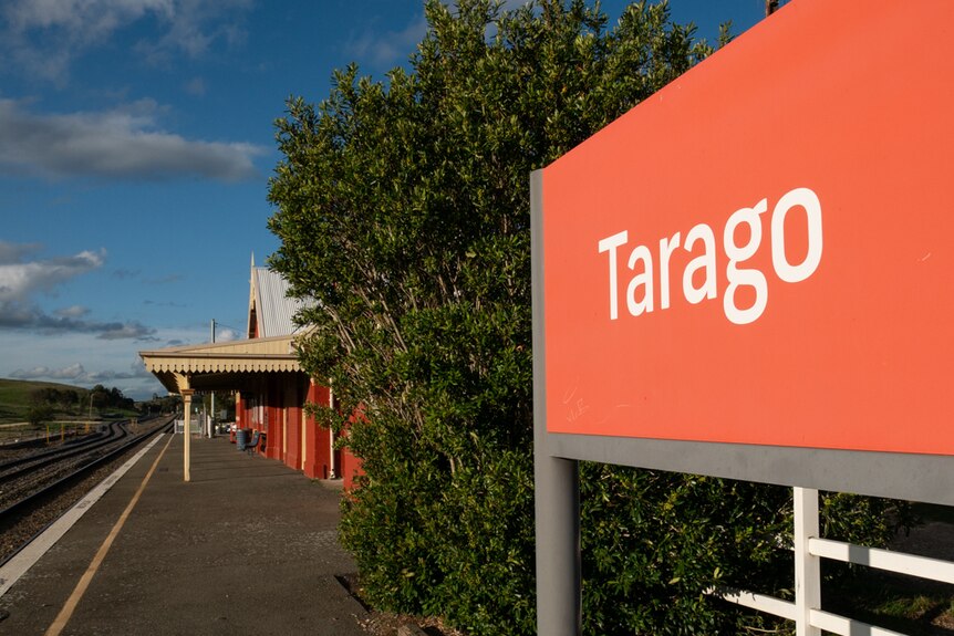 a train station with a sign reading tarago
