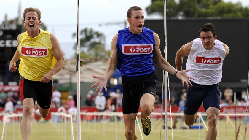First home... Sam Jamieson (centre) wins the Stawell Gift with Richard Hankin (left) second.