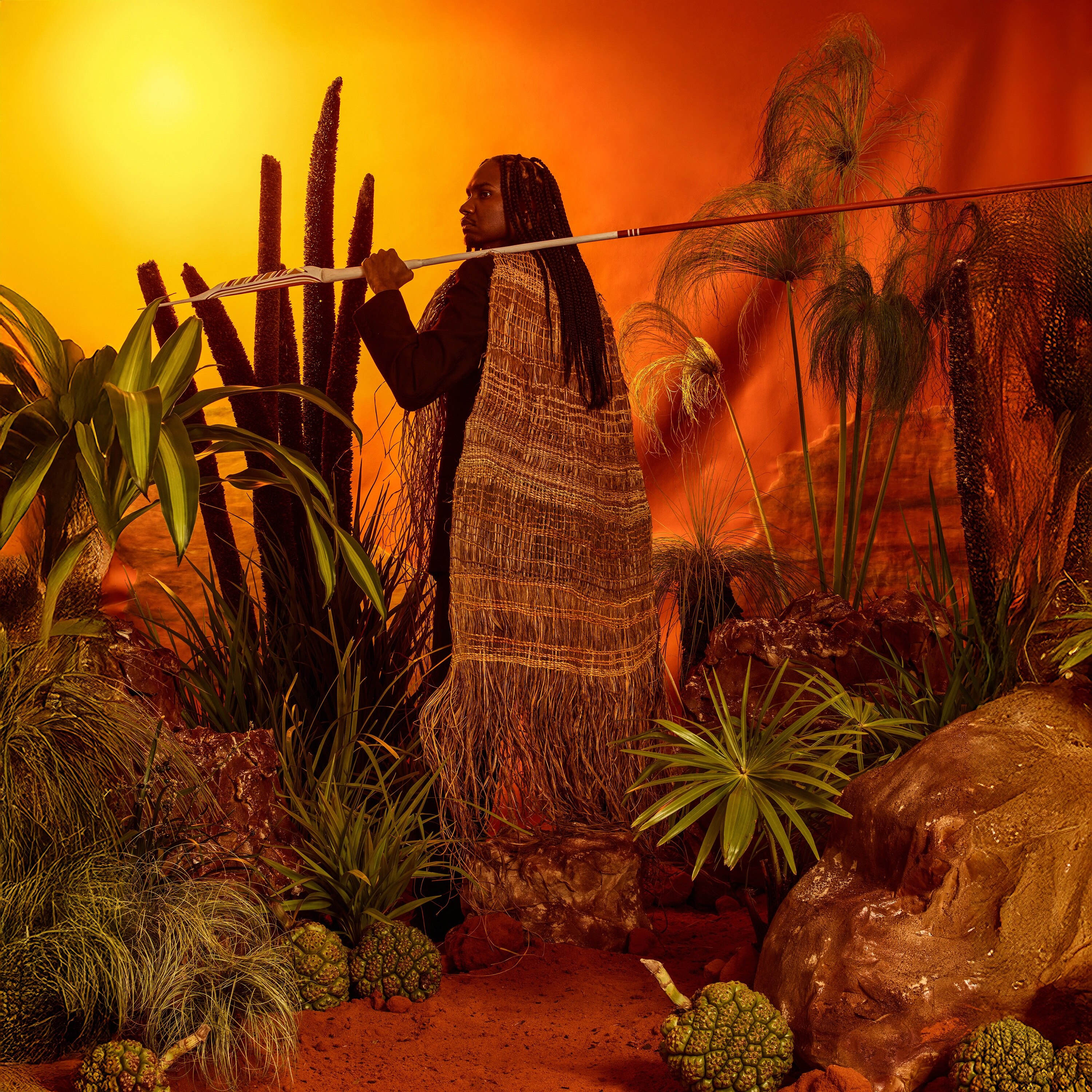 Baker Boy album cover, which shows Baker Boy in traditional dress holding a spear in front of a outback landscape