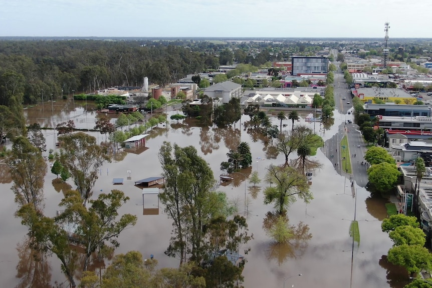 Flood waters encroaching on a town, flooded streets