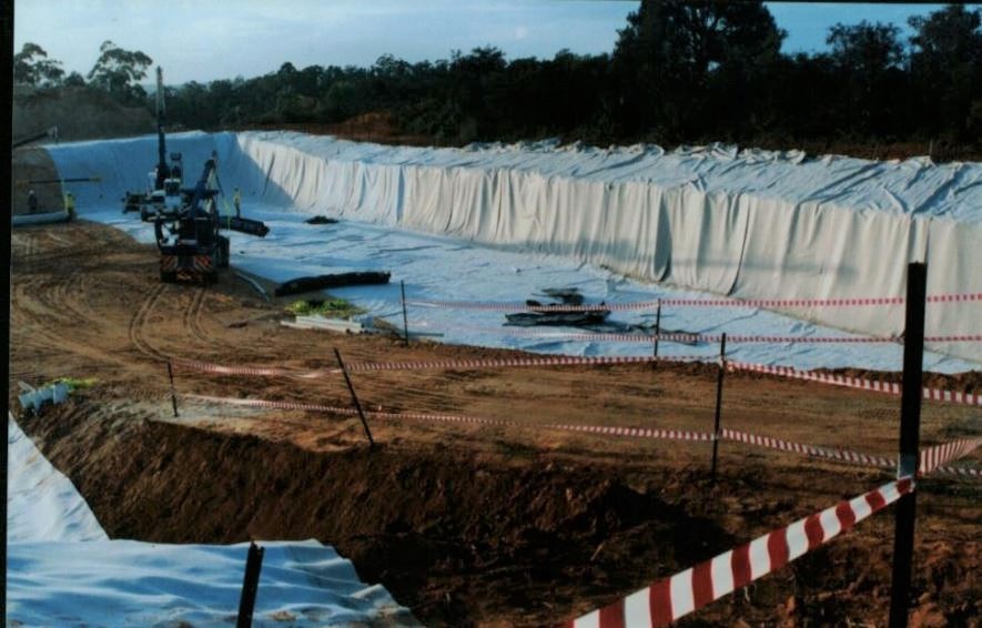 Massive chicken burial pit, lined with plastic during the Newcastle Disease outbreak on Mangrove Mountain. 1999.