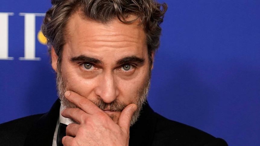 Joaquin Phoenix poses backstage