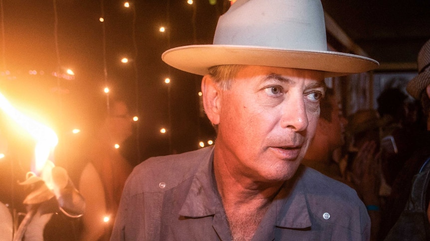 Larry Harvey wearing a hat at Burning Man