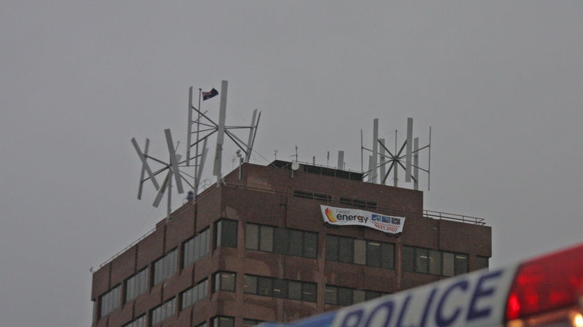 Broken wind turbines atop Hobart Marine board building.