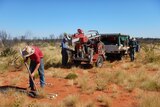 Northern Territory government workers drill soil in Central Australia to find horticulture potential