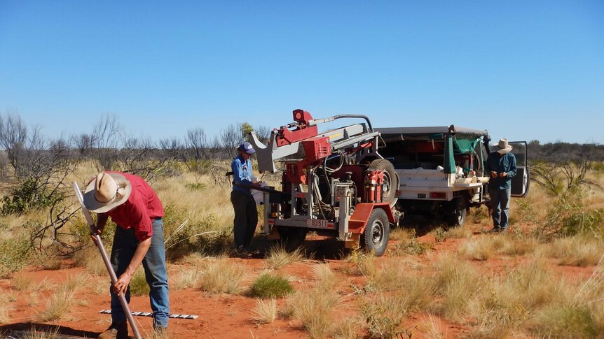 Northern Territory government workers drill soil in Central Australia to find horticulture potential