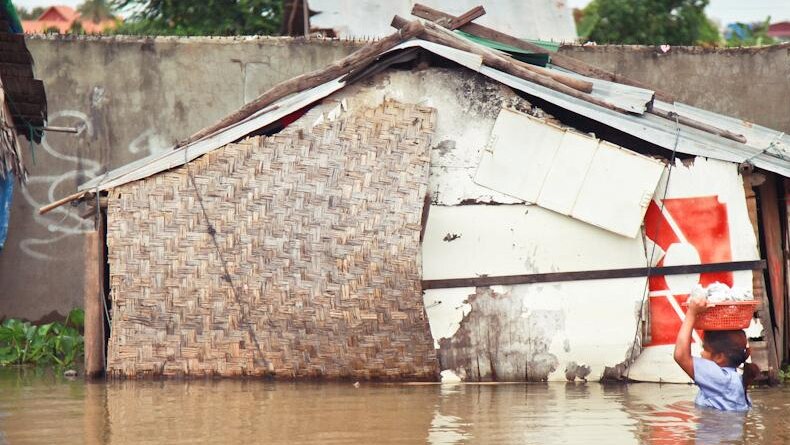 Girl wades through Cambodian floods