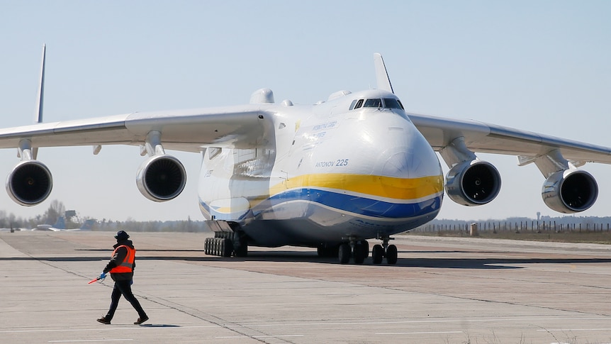 An Antonov An-225 Mriya cargo plane taxis after landing at an airfield in the settlement of Hostomel.