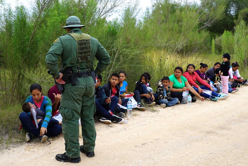 National Border Patrol agents intercept a group of migrants.
