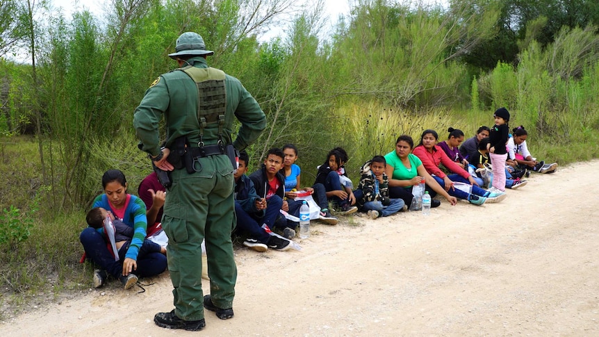 National Border Patrol agents intercept a group of migrants.