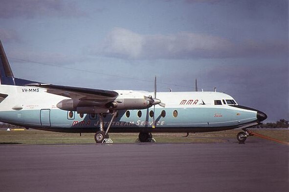 A Fokker F27 Friendship aircraft parked on a runway.