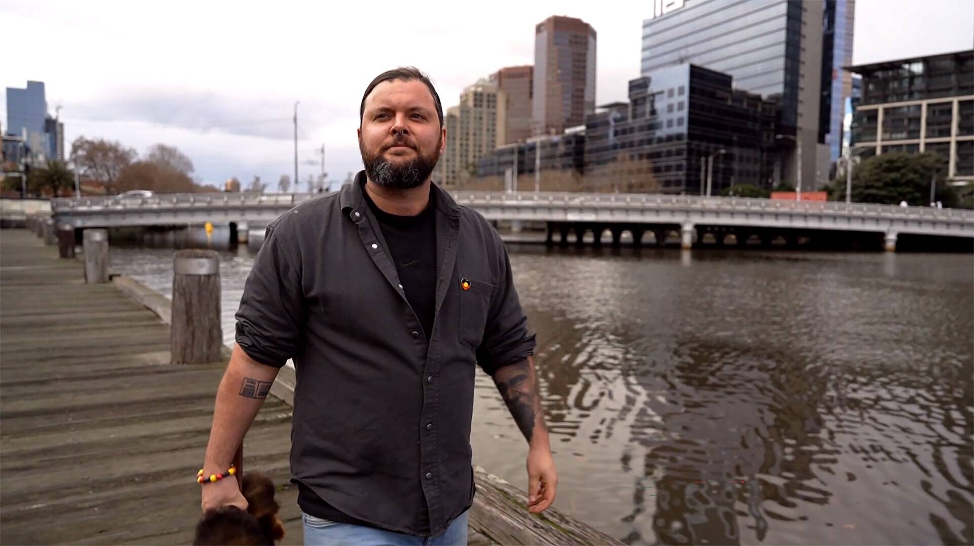 Jaeden Williams walks beside Yarra River