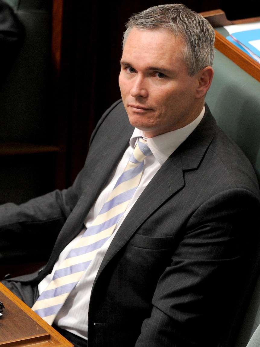 Craig Thomson listens during question time in Canberra.