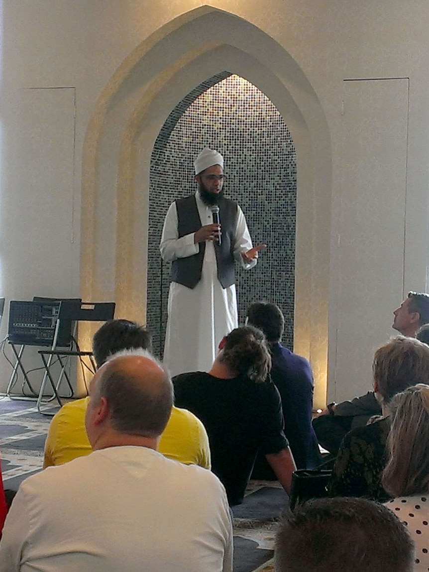 Visitors to the Masjid Ibrahim mosque listen to Imam Burhaan Mehtar