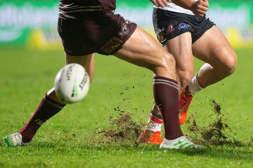 Lachlan Lam stabs a grubber kick, creating a divot on the Brookvale Oval turf.