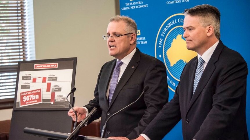 Scott Morrison and Mathias Cormann address the media.