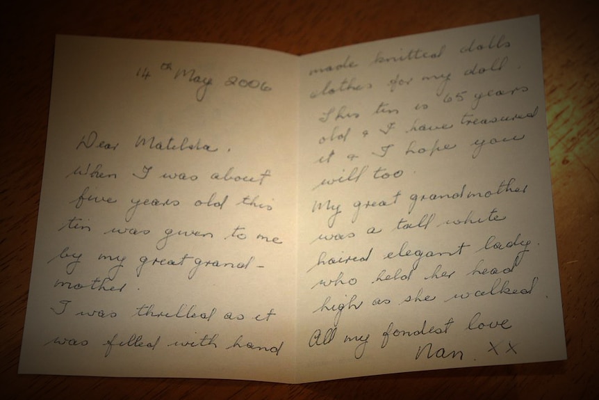 Close-up of hand-written letter on table