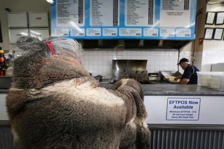 Esther Kirby at the counter at her local fish and chip shop in Kerang.