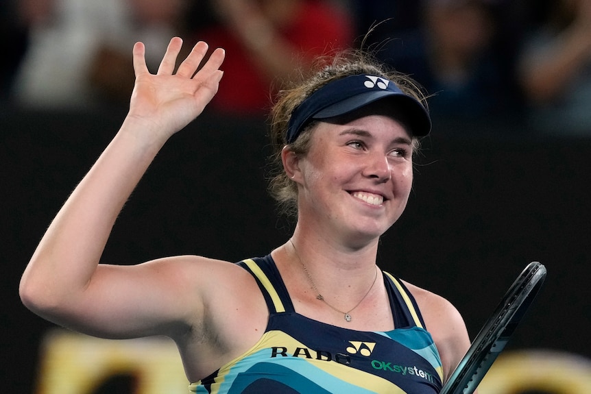 Linda Noskova waves to Australian Open after beating Iga Swiatek.