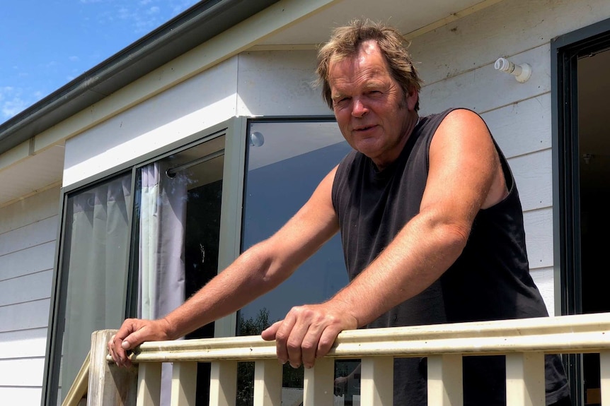 David Philliponi stands outside his home at Wantirna Caravan Park.