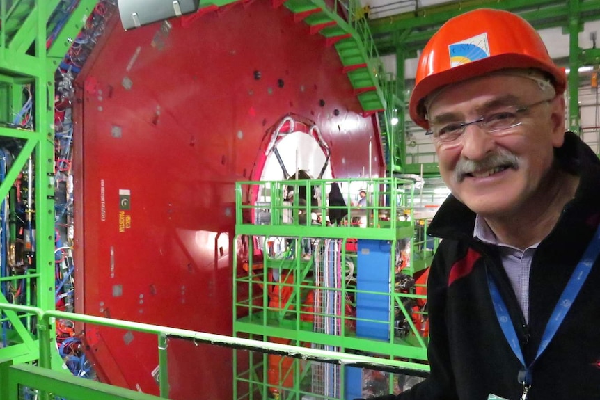 Astronomer Fred Watson underground at the Large Hadron Collider with lots of machinery in the background