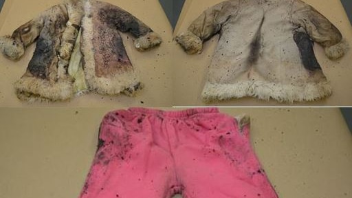 Clothing found in dumped suitcase