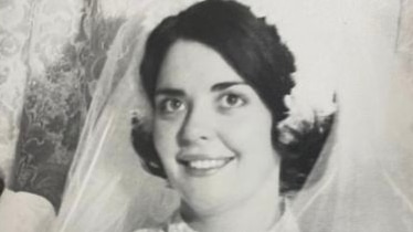 Black and white photo young dark haired woman in wedding dress