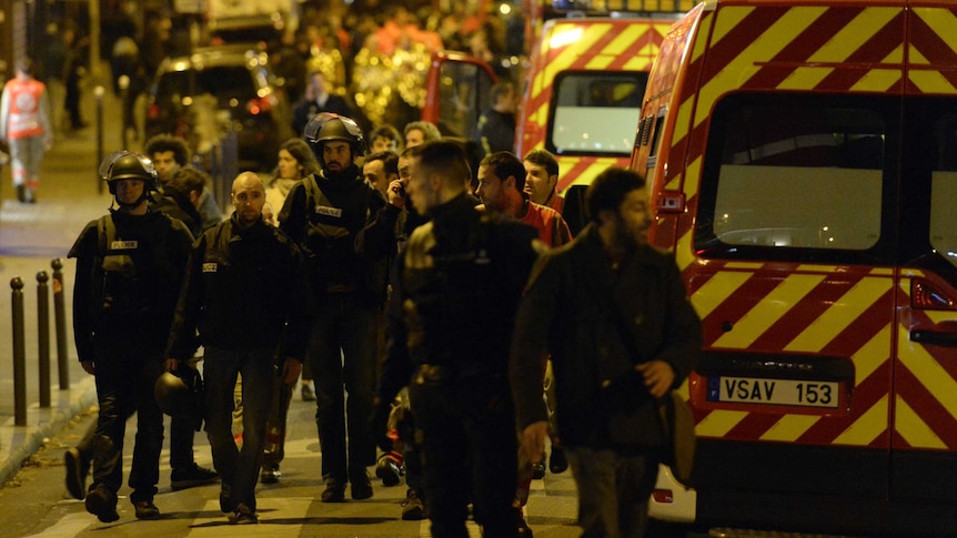 French police arrive at the scene of the Paris attacks.