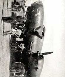 A black and white photo of an air forces bomber with people standing below it
