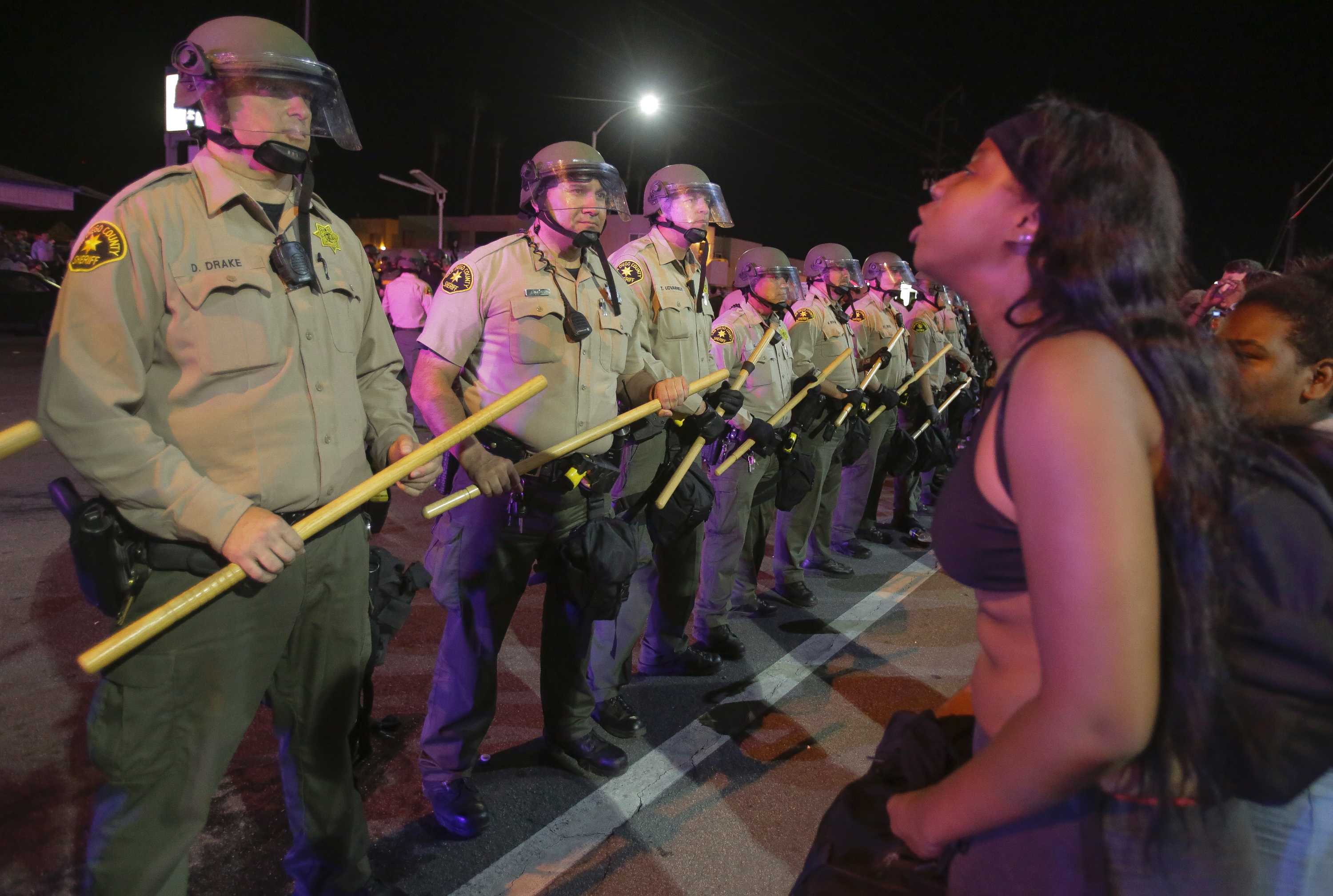 Protests grow tense after fatal police shooting of black man in ...