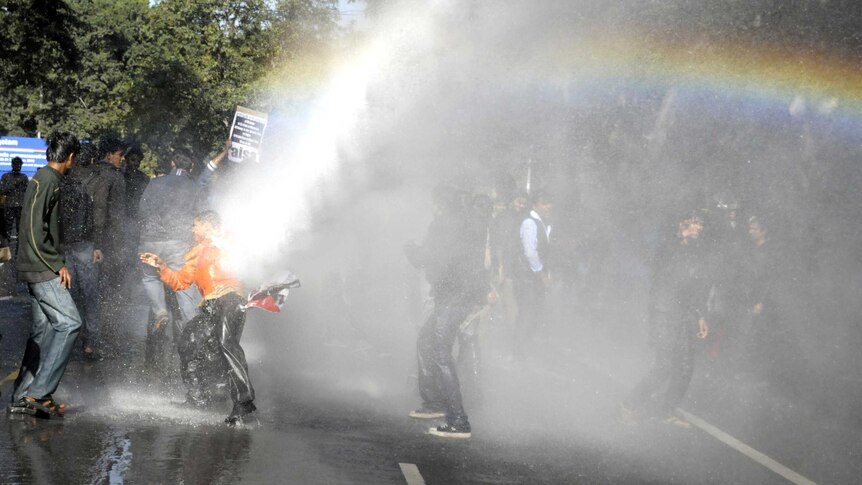 Water cannon used on demonstrators protesting the gang-rape of a student on a bus in New Delhi.