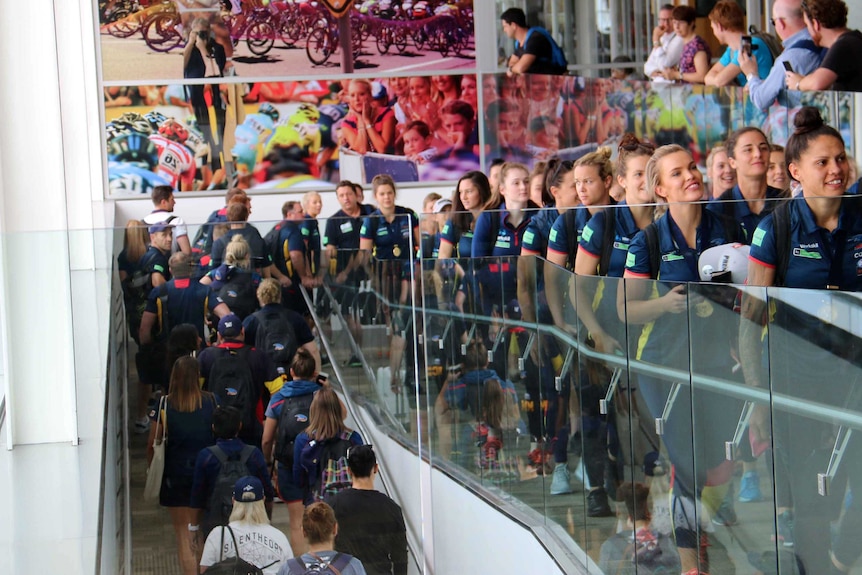 Adelaide Crows women's team arrives back in Adelaide.