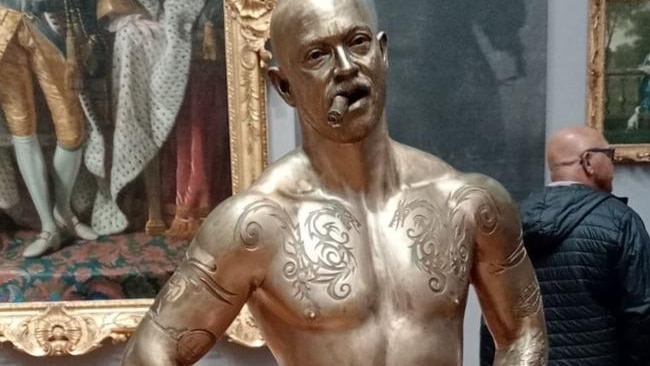 bronze sculpture of a naked human with male upper half and female lower half