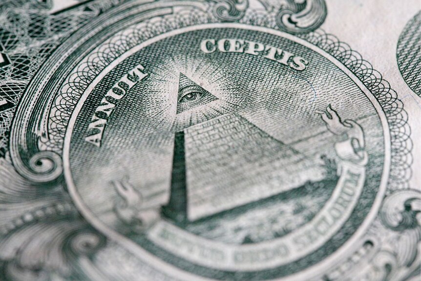 The reverse of the United States one-dollar bill depicting a Pyramid with 13 steps and the Eye of Providence.