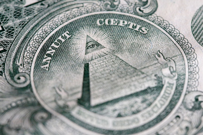 The reverse of the United States one-dollar bill depicting a Pyramid with 13 steps and the Eye of Providence.