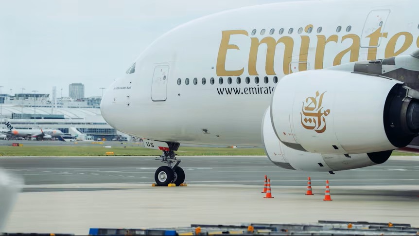 The front of a grounded Emirates plane. 
