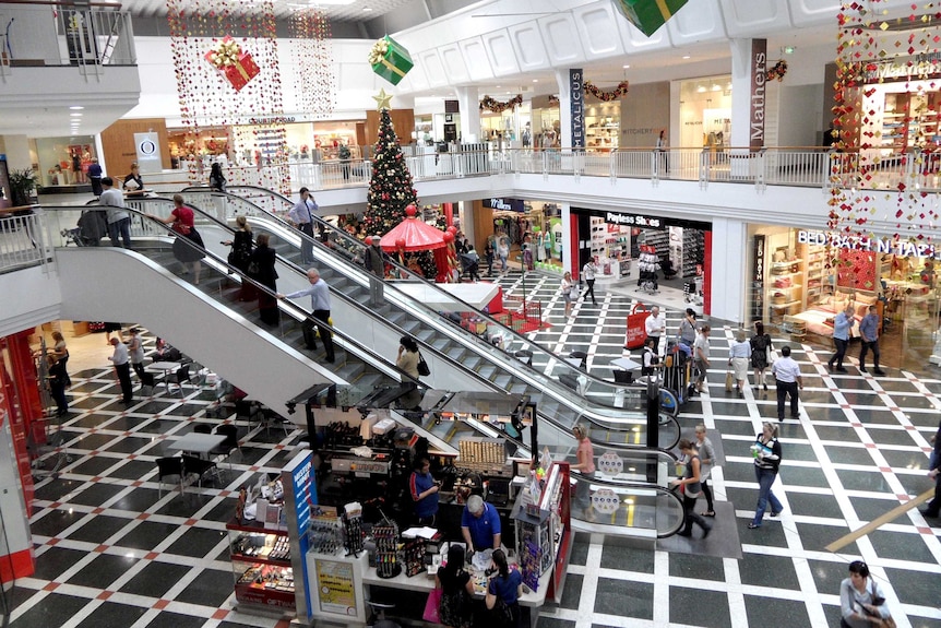 Customers shopping inside a retail mall.