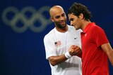 James Blake of the United States shakes hands with Roger Federer of Switzerland