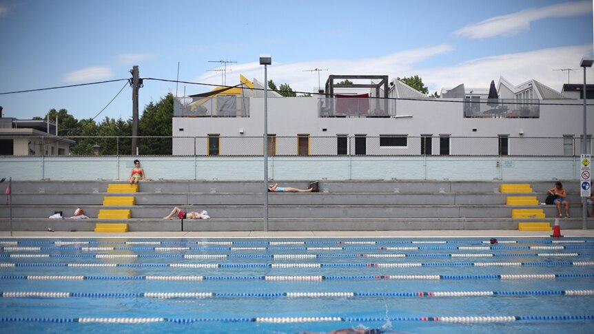 Melburnians swim and enjoy the sun at the Fitzroy Swimming Pool.
