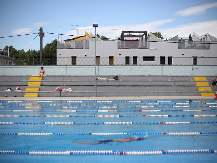 Melburnians swim and enjoy the sun at the Fitzroy Swimming Pool.