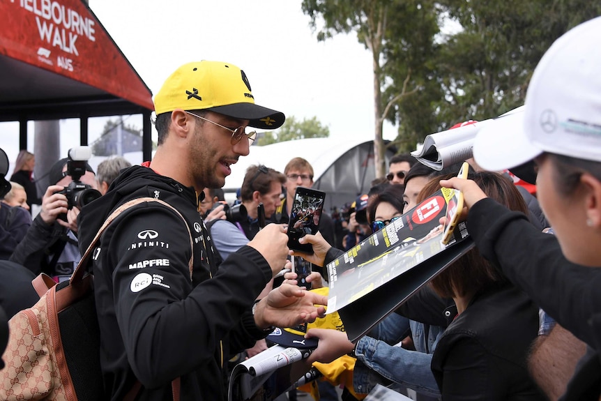 Daniel Ricciardo signs autographs