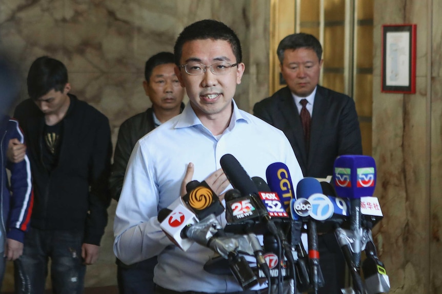 Xiaolin Hou, boyfriend of Yingying Zhang, speaks at a press conference.