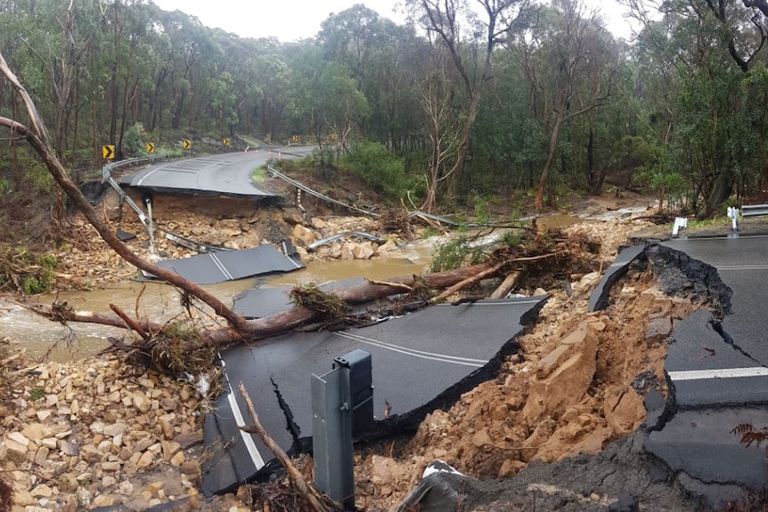 Road broken away over floodwaters