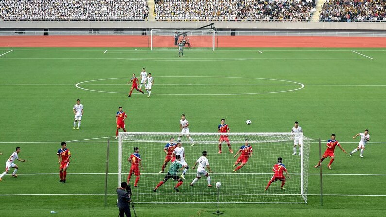 Long shot of two North Korean football teams playing in Pyongyang