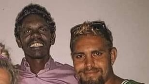 two indigenous men standing next to each other