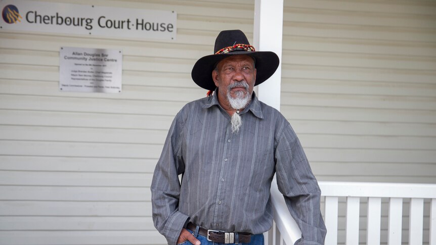 Cherbourg elder Cyril Bligh standing outside the courthouse.